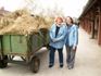 Wallyce and Mariellyn by a hay cart in Hungary